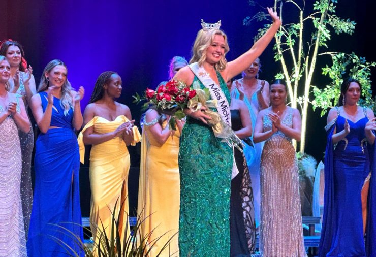 Maya Schuhknecht winning Miss Michigan, wearing green dress with sash and crown.