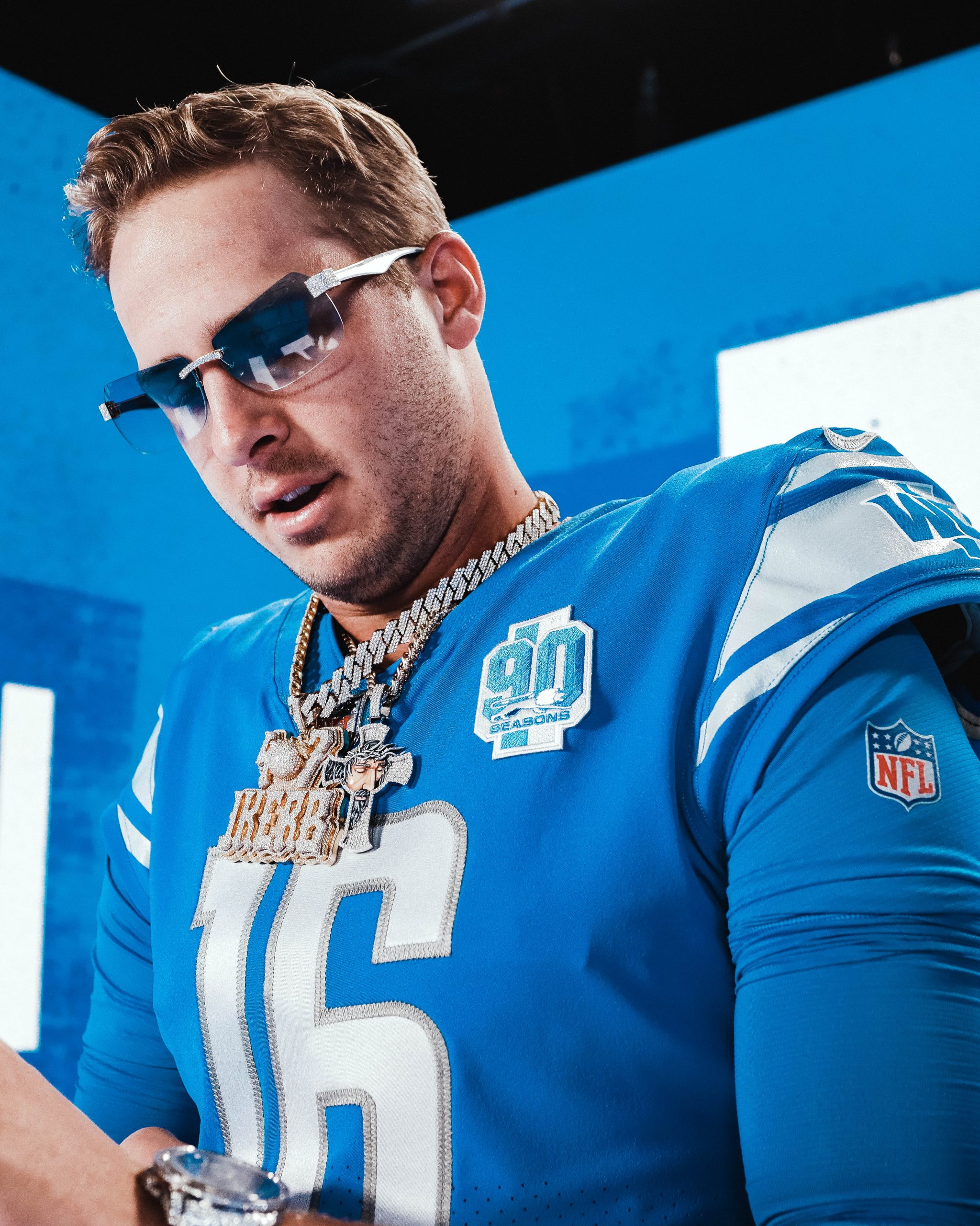 Close up of Lions quarterback Jared Goff in uniform and sunglasses