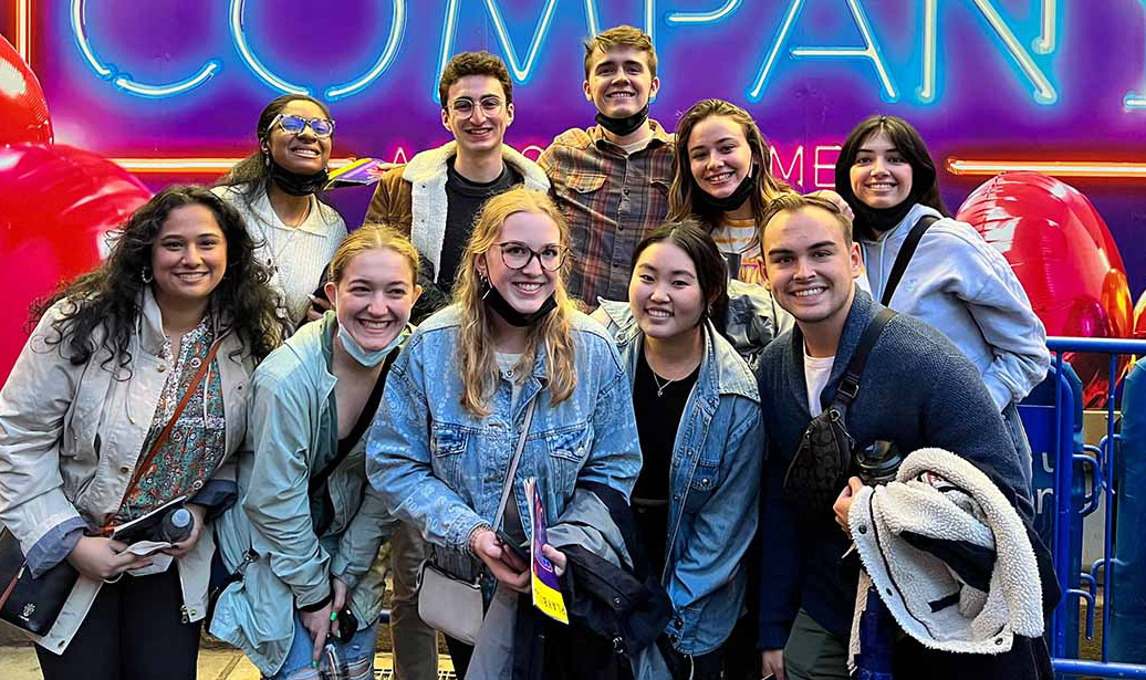 MSU students pose in front of sign for Broadway show 