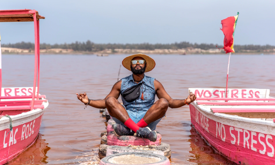 Vadu meditating sitting on tires in a lake.