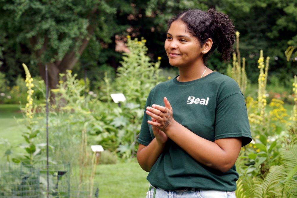 Angelica Bajos wearing a green shirt that says, 