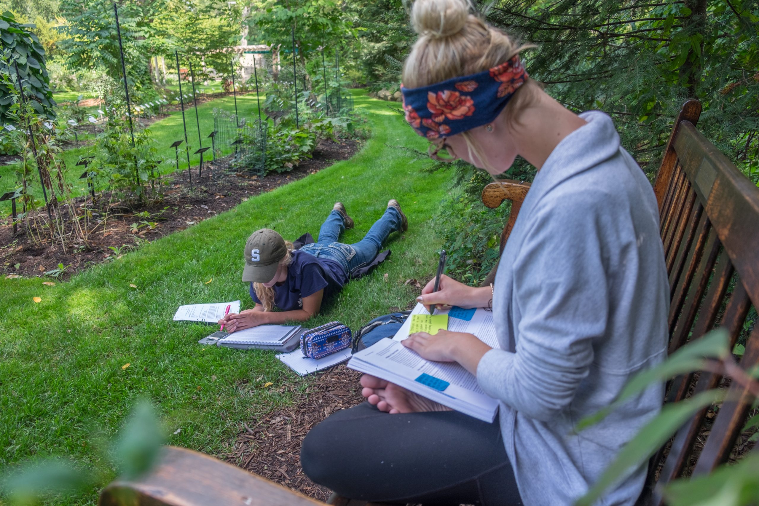 New Freshmen students studying in the William J. Beal Botanical Gardens on a warm fall afternoon