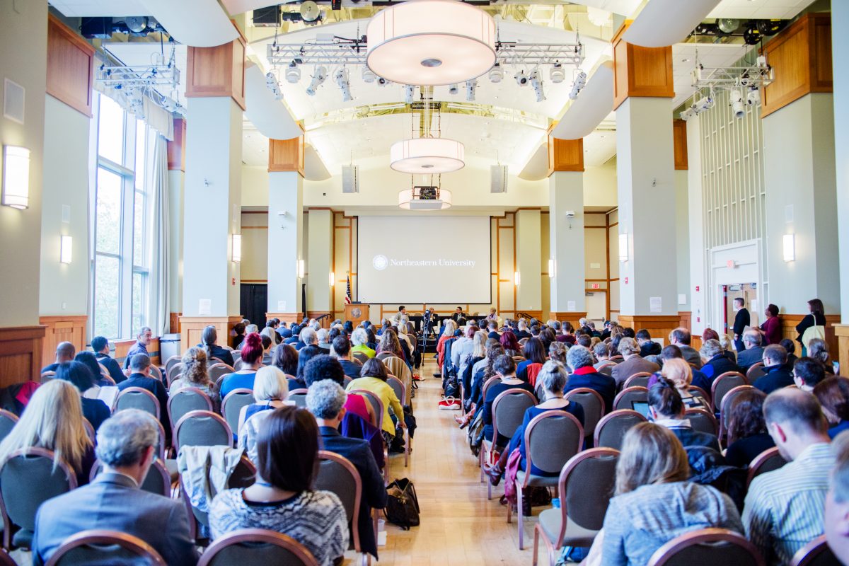 Large ballroom full of seated conference attendees