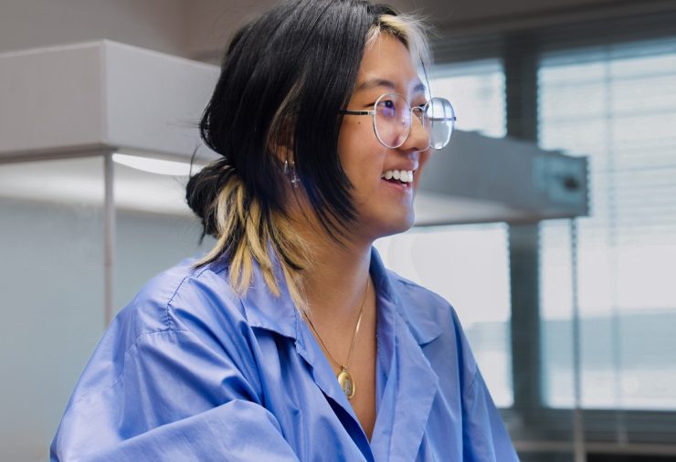 Faith Nhkum smiling inside a lab