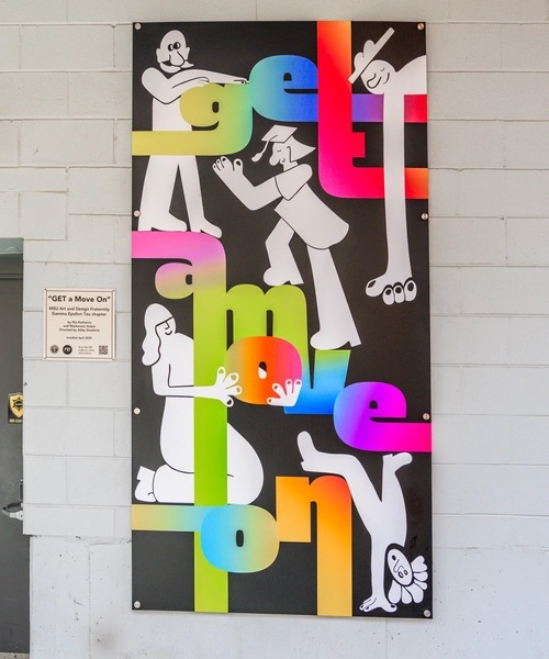 A photo of a colorful mural with the words 