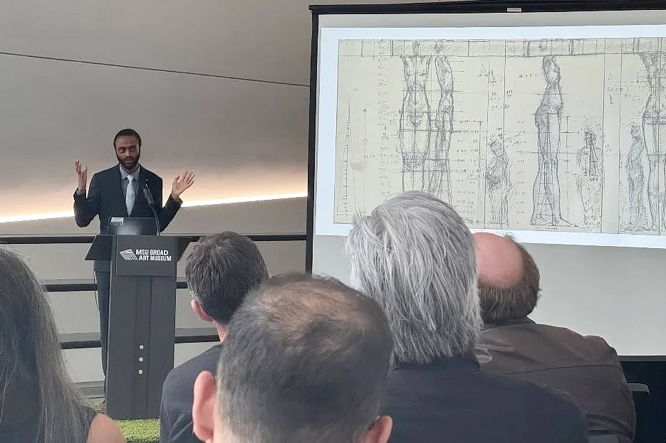 Man presenting at a podium with